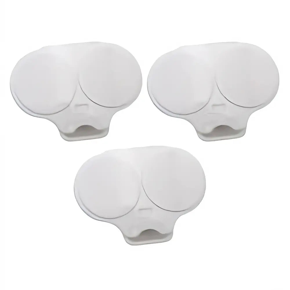 Three white plastic replacement parts with oval circular tops and a small slot cutout at the base, arranged on a plain white background.