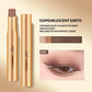 Gold eyeshadow stick shown open and closed on a beige background, with text reading '02#PEARLESCENT EARTH,' a color swatch strip, and a close-up eye wearing the shade.