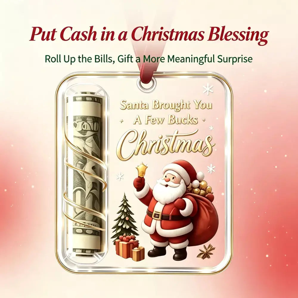 A Christmas-themed cash-blessing gift tag or ornament design shown on a soft pink background. The product features a rolled dollar bill inside a clear cylindrical section, gold decorative script text reading 'Christmas,' Santa Claus illustration, a small Christmas tree, and wrapped gifts.