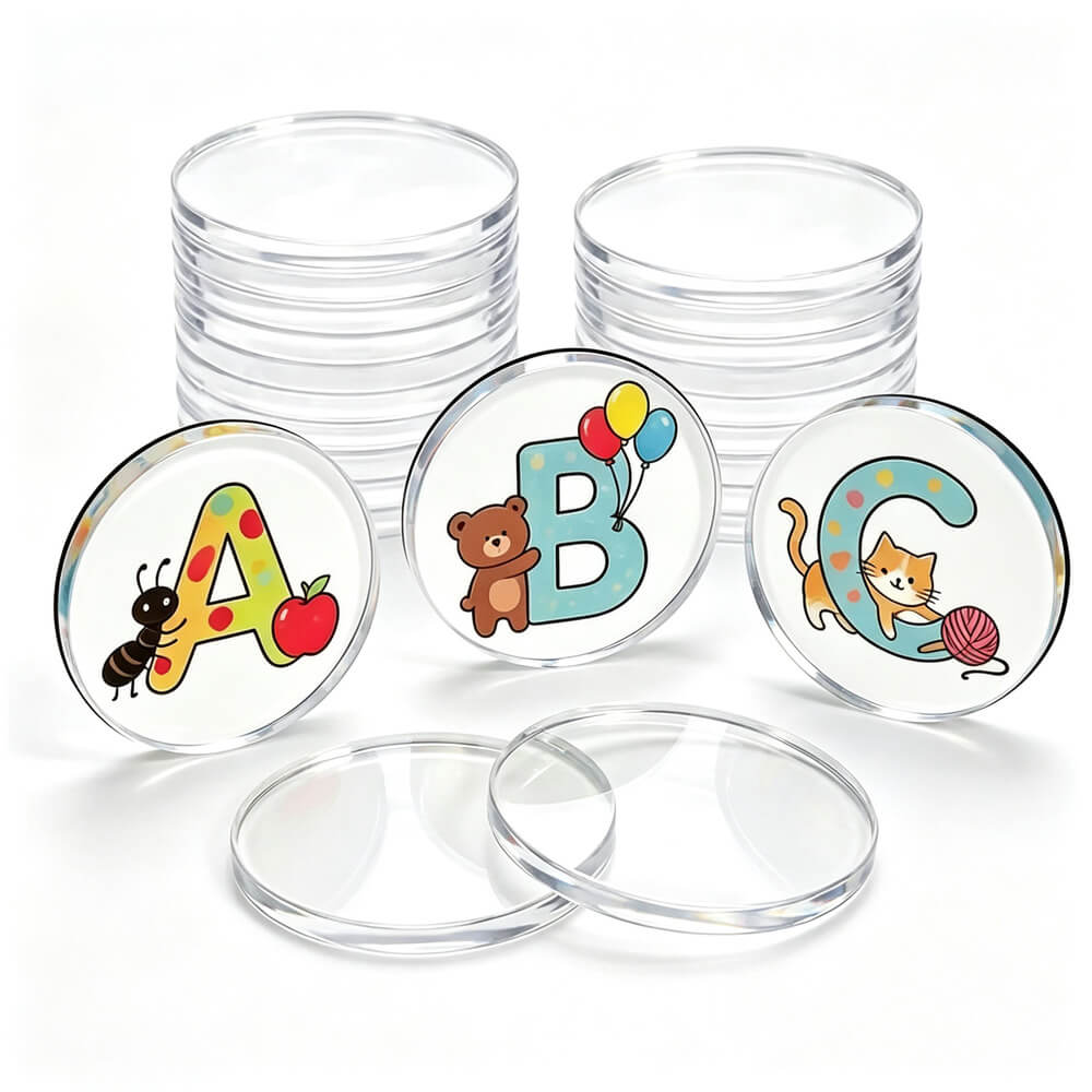 A set of clear round plastic coin tubes with three example coins displayed in front showing colorful alphabet letters A, B, and C with cartoon illustrations, on a white background.