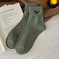 Crew socks featuring a small embroidered bat for Halloween