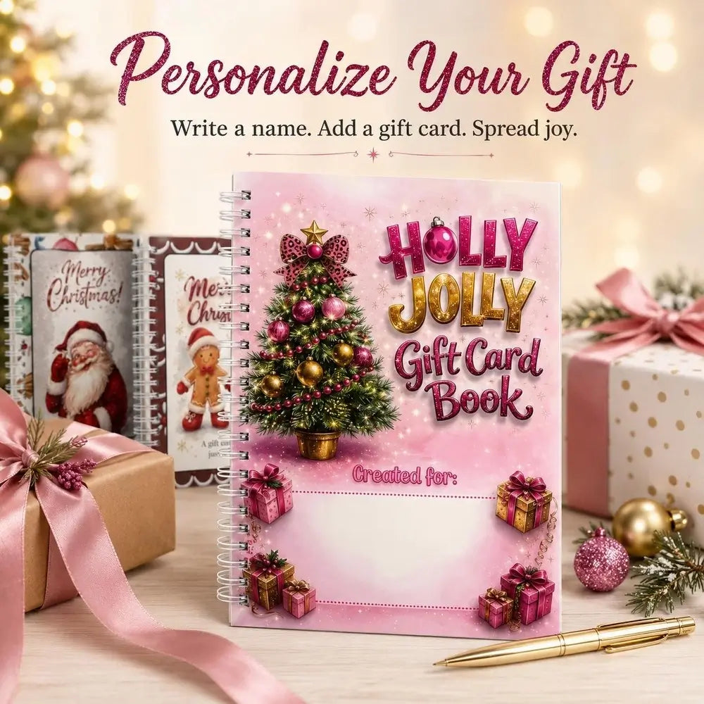 A spiral-bound pink 'Holly Jolly Gift Card Book' stands on a tabletop with holiday-themed wrapping paper, presents, ornaments, and a gold pen around it. Large text at the top reads 'Personalize Your Gift' with smaller copy below.