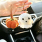 Close-up of the crochet stitches and details on a ghost pumpkin charm