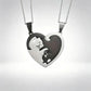 Two matching silver heart-shaped pendant necklaces with cat cutouts, displayed against a light gray gradient background.