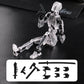 A transparent acrylic action figure of a kneeling robot or mecha on a black textured surface, with interchangeable black weapon and limb accessories shown in a white box at the bottom.