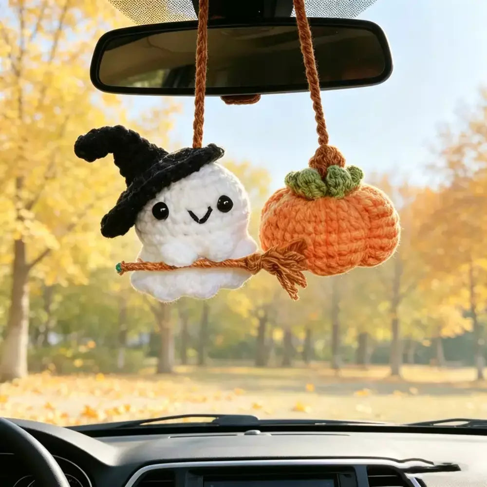 Handmade yarn ghost and pumpkin ornament with a knitted texture