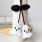 Handmade yarn ghost ornament with a knitted texture