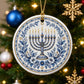 Detailed blue floral pattern and menorah illustration on a Hanukkah ornament