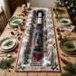 A quilted table runner with snowy valley tunnel track and a retro toy train between mini Christmas trees on a wooden table with plates and ornaments
