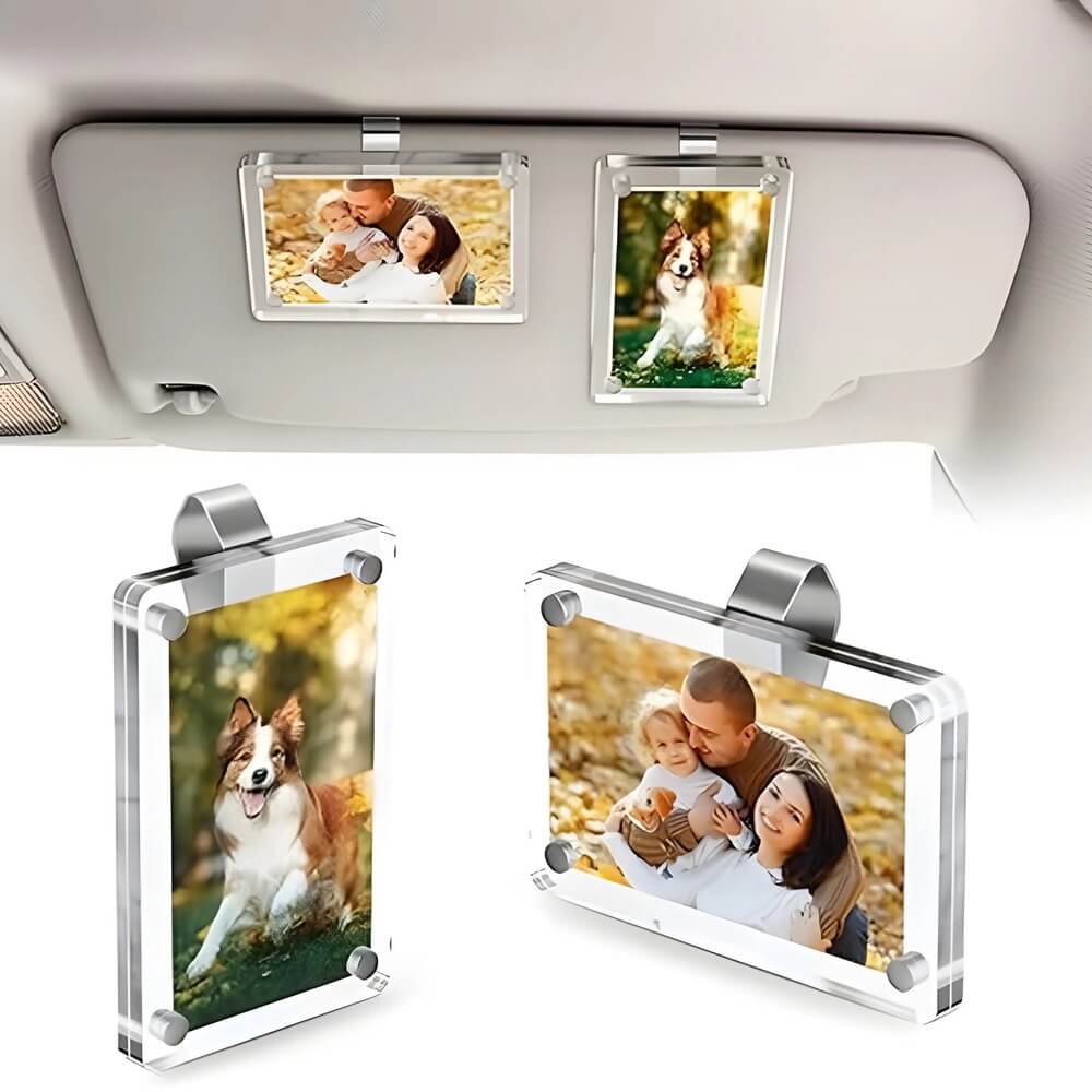 Car visor with multiple photo frames displaying family and pet images.
