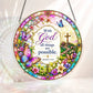 A round acrylic suncatcher decorated with butterflies flowers and a cross featuring the bible verse with God all things are possible
