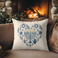 The menorah artwork on a holiday pillow
