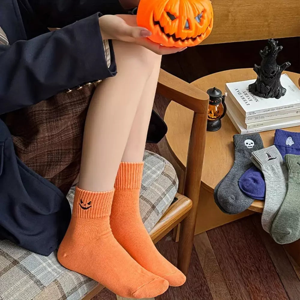 Pumpkin orange Halloween crew socks with a festive motif