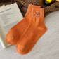 Halloween socks with a pumpkin embroidery design