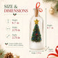 A glass holiday ornament bottle with a miniature Christmas tree inside, shown with overlaid size and dimension labels: height 8.7 in, width 2.