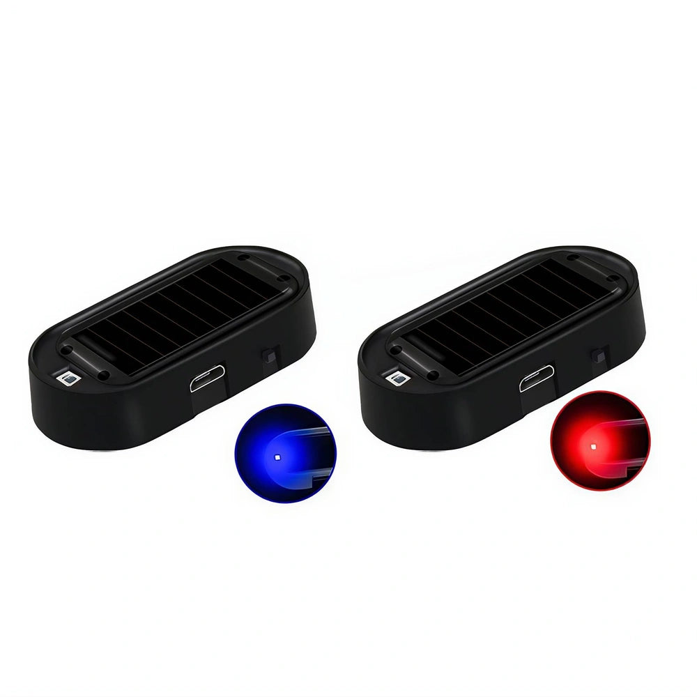 Two black rectangular solar-powered light devices shown on a white background, each with a small circular inset indicating an illuminated blue light on the left and a illuminated red light on the right.