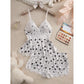 White women's Halloween pajama set with black cat and spooky character print