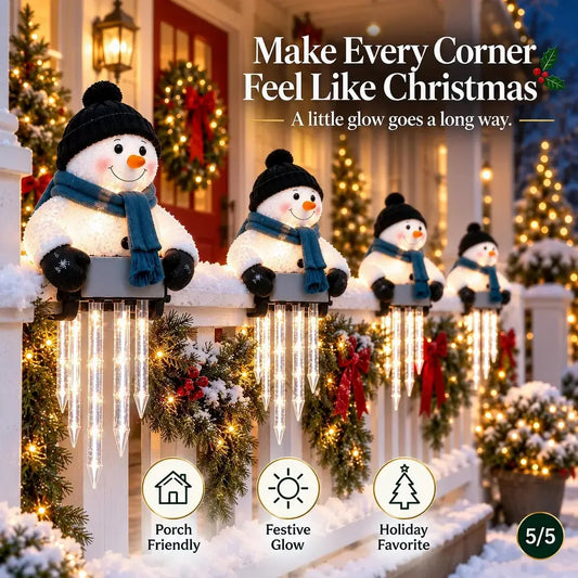 Five fluffy snowman porch lights with LED icicle strands are displayed on a snowy white fence in front of a decorated Christmas house. The text at the top reads 'Make Every Corner Feel Like Christmas' and the bottom features feature icons and labels.