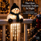 A glowing snowman holiday light decoration sits on a snowy porch railing at night, with warm string lights and a decorated Christmas tree in the background. Text on the image reads, 'The Glow Everyone Notices At Night' and 'BRING WARMTH TO YOUR HOLIDAY HOME.