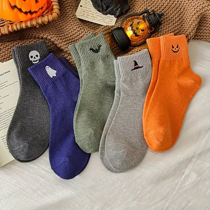 Five pairs of women's Halloween crew socks with assorted spooky designs